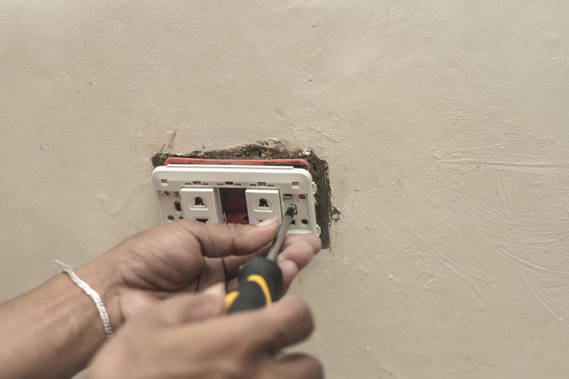 Handyman Fixing Electrical Outlet